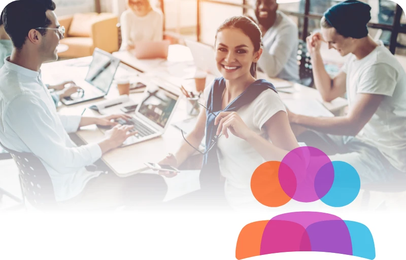 Happy woman looking at the camera participating in a meeting with a diverse team